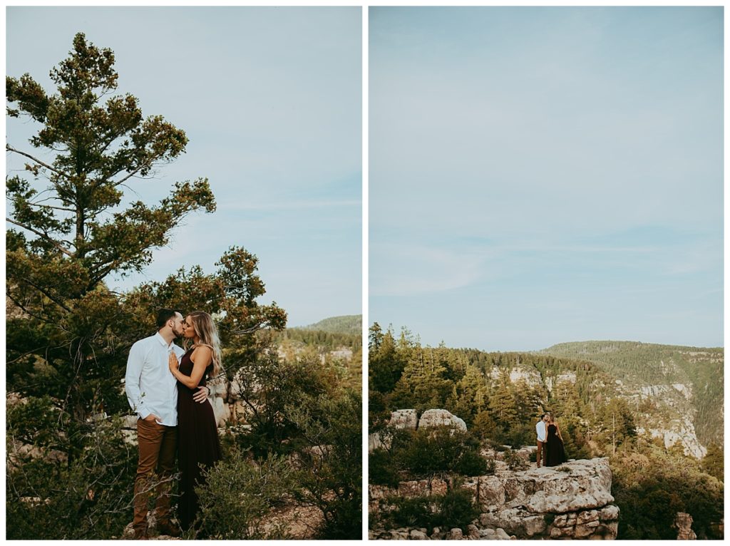 man and woman embrace and kiss on forested cliffs outside of Flagstaff Arizona