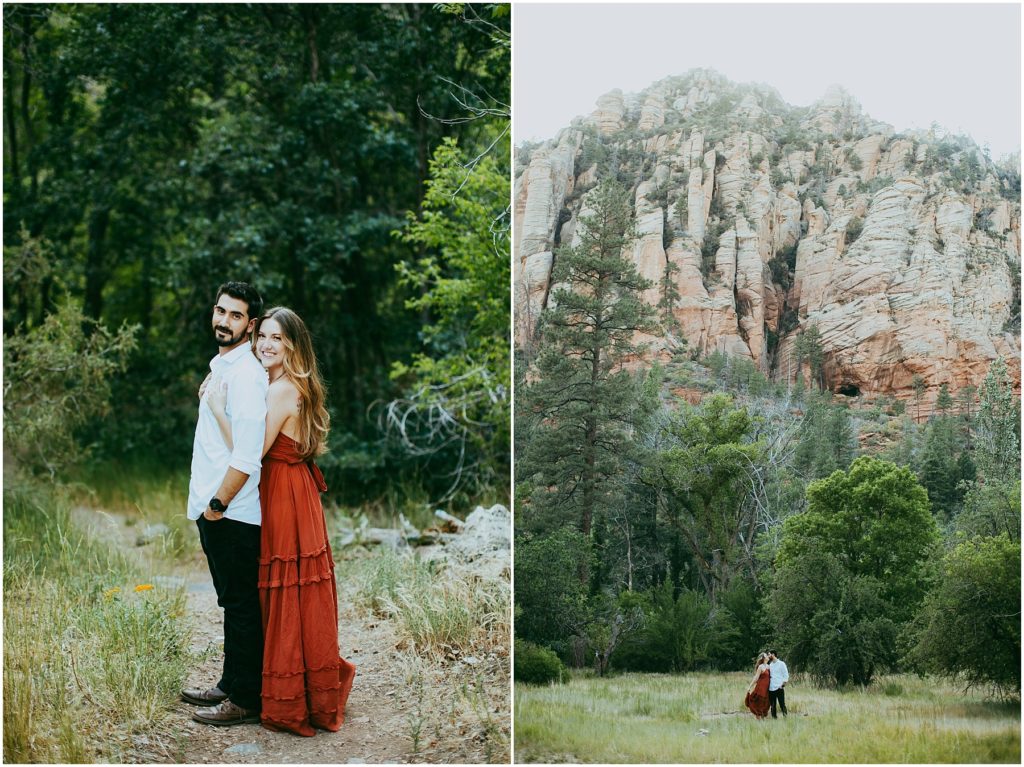 couple holds each other in oak creek canyon beneath large red rocks