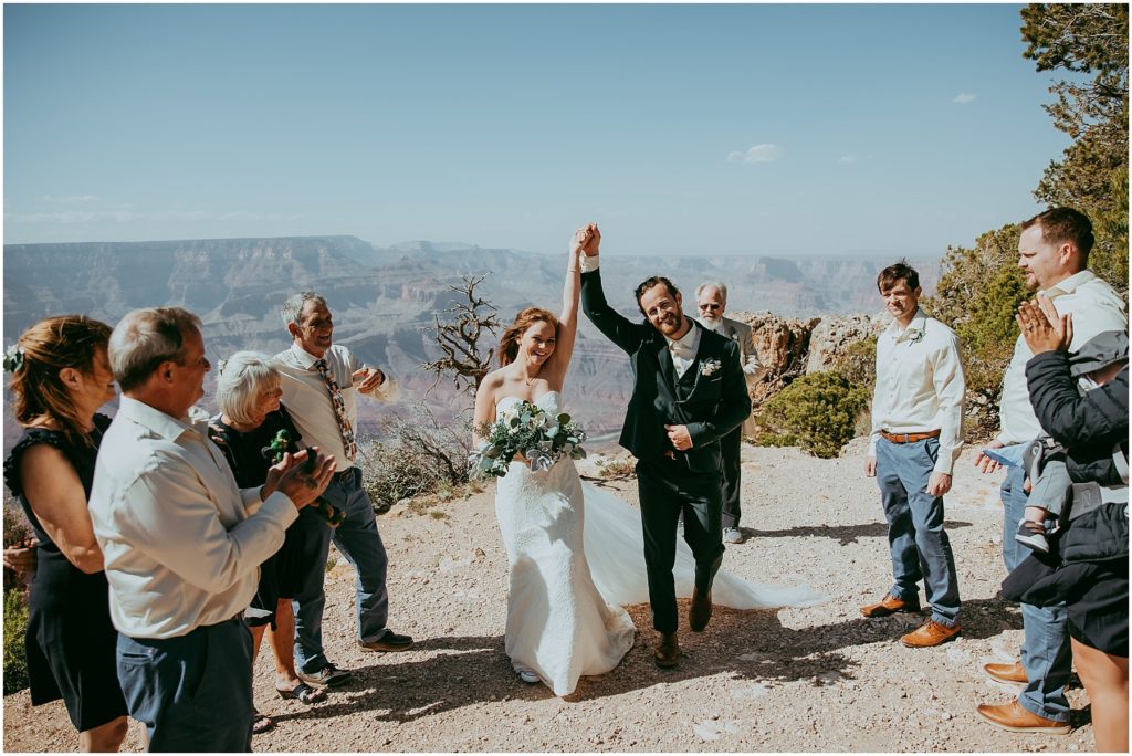 bride and groom cheering