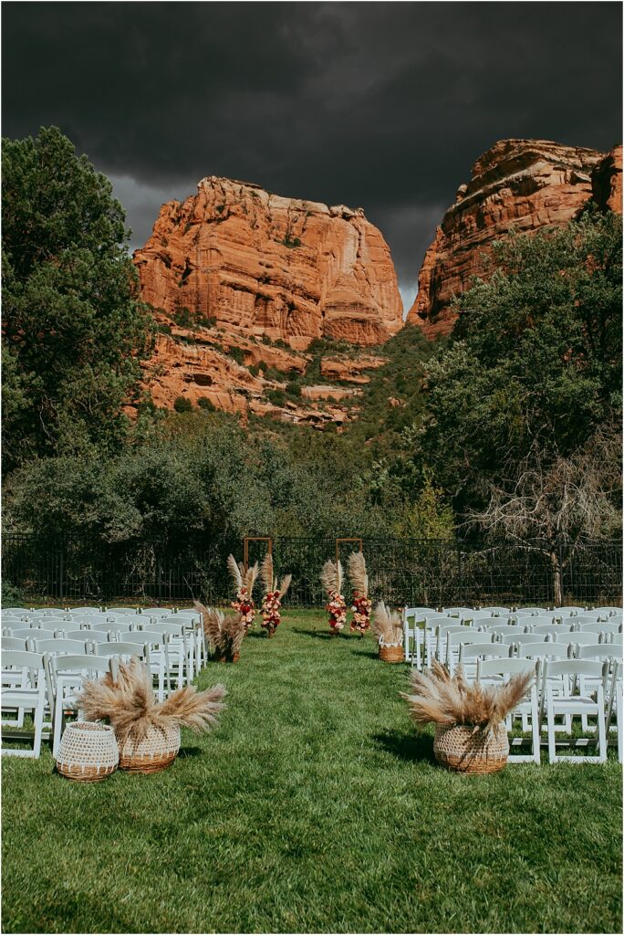 Arizona monsoon storm above Sedona red rocks and empty wedding ceremony chairs