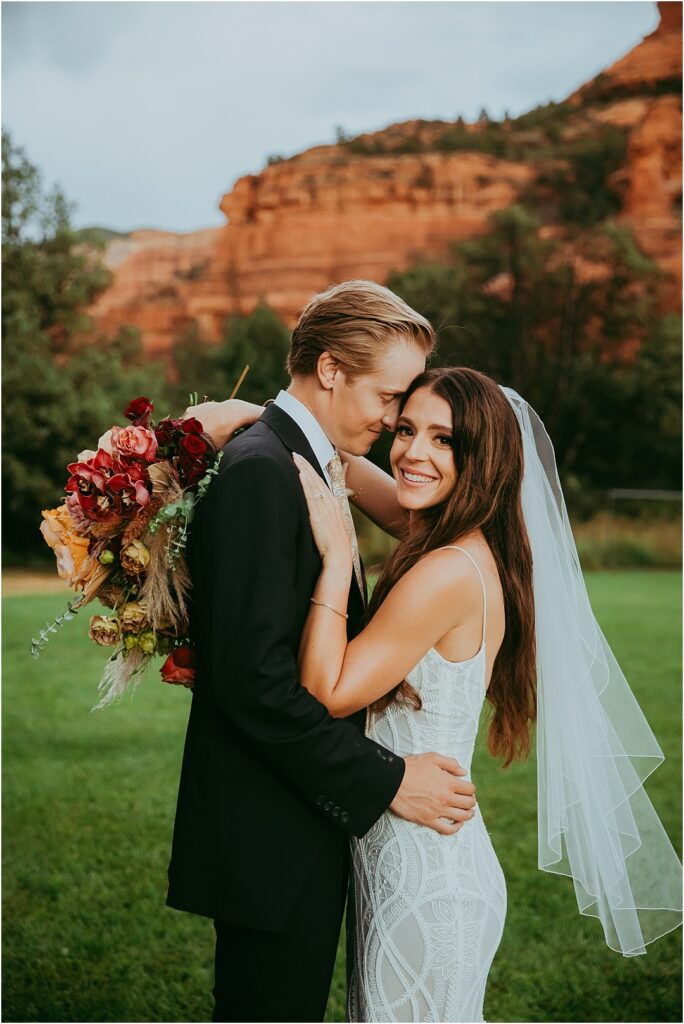 bride and groom pose for bridal photos in Sedona