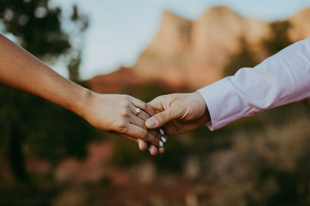 man and woman holding hands in Sedona