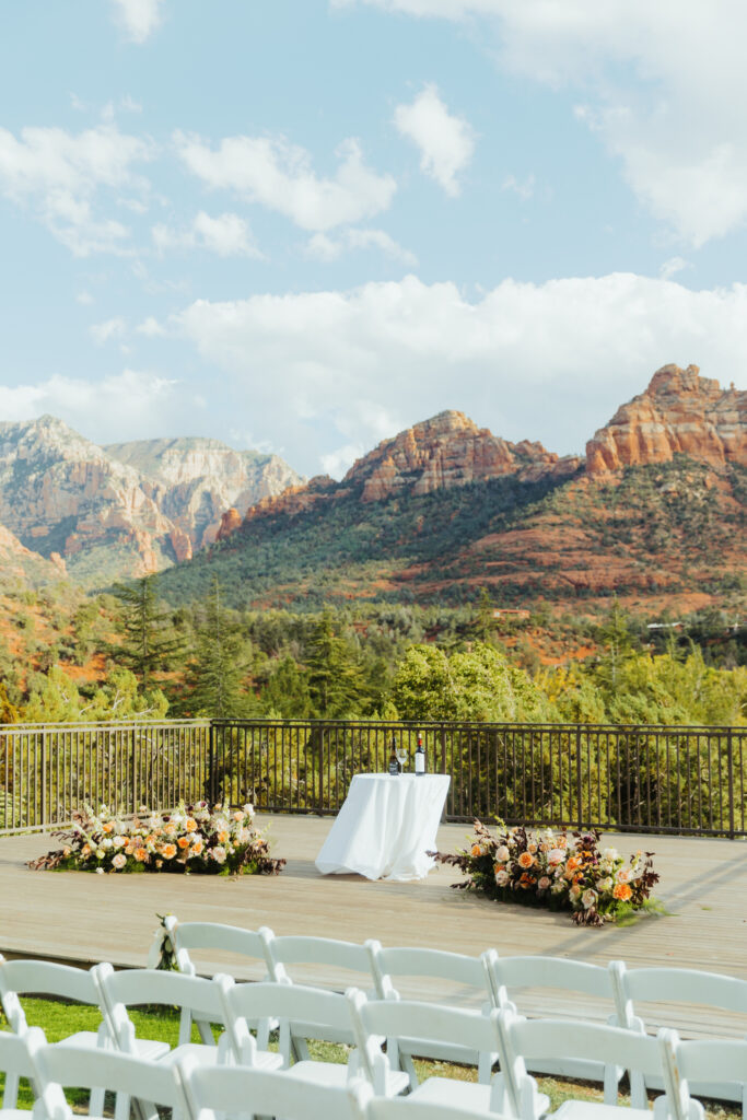 a wedding ceremony's decor displayed before a wedding at L'Auberge de Sedona with a beautiful red rock background