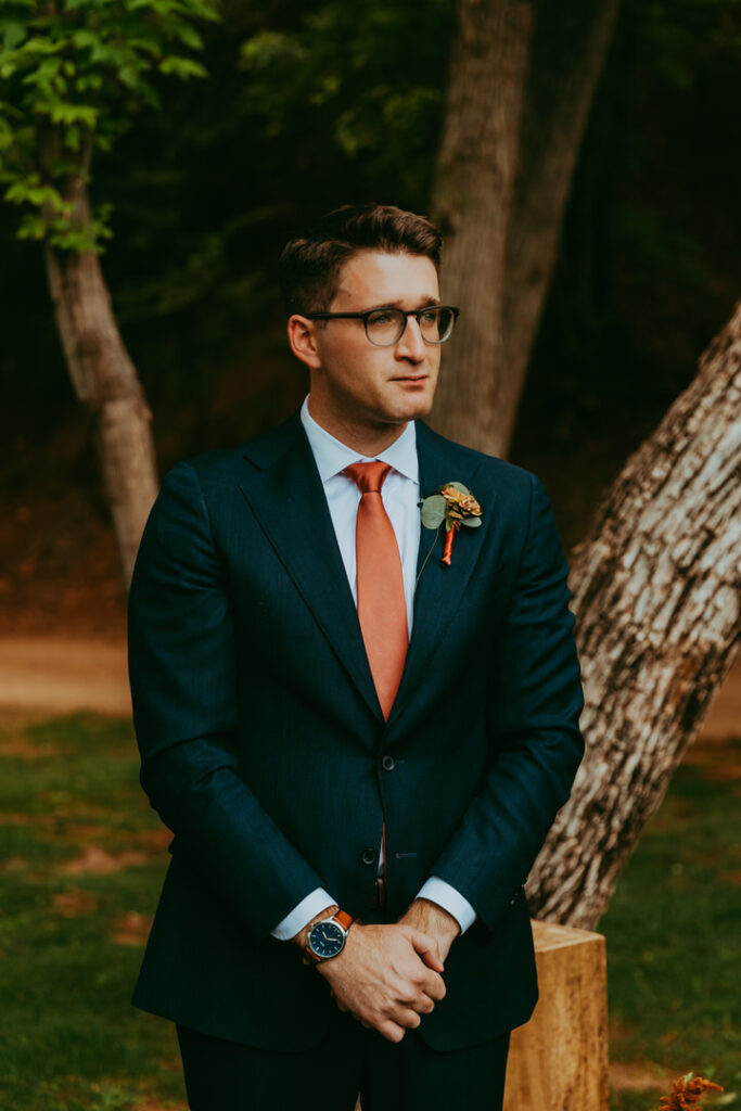 Groom tearing up as he sees his bride