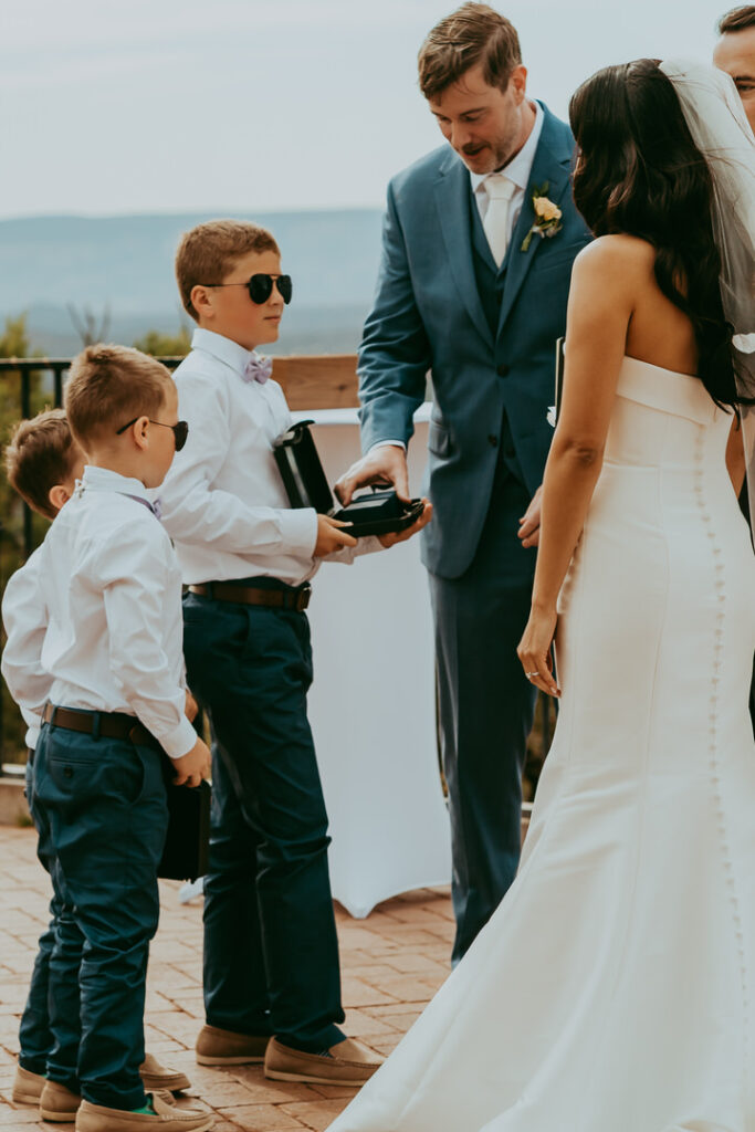 ring bearers bringing the rings to bride and groom