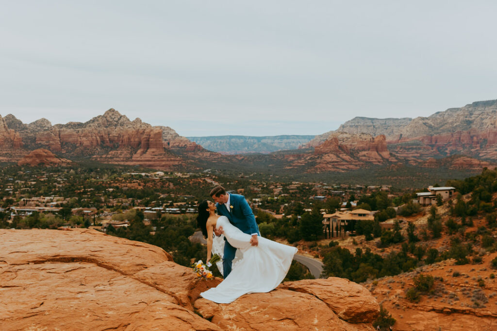 couple with sedona red rock views doing a dip