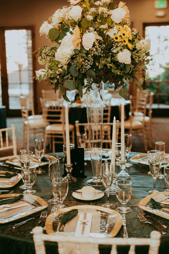 Stunning tabletop decor with green tones and sunflowers. 
